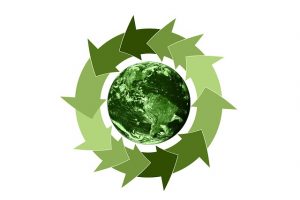 un logo de régénération du filtre a particule avec des flèches vertes qui font un cycle